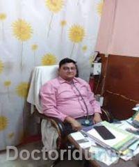 Dr Mukesh Tandan